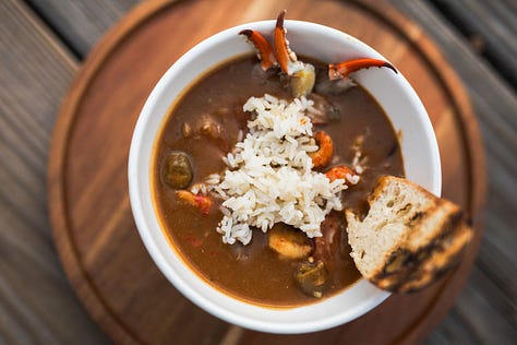 “Chefs from Aramark Collegiate Hospitality showcasing coastal-inspired dishes at the NC Seafood Festival 2025 — including seafood risotto, crab gumbo, and fried shrimp tacos — during live cooking demos and tastings with festival guests.”