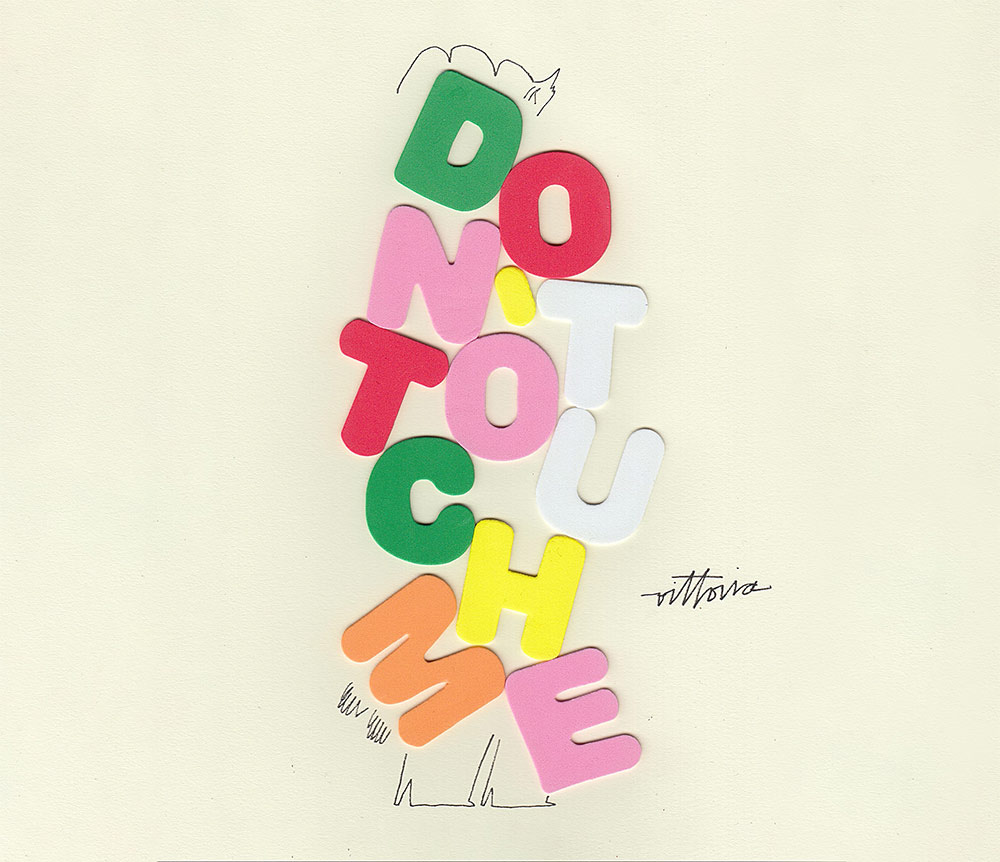 A solitary figure of a woman dressed in foam bubble letters that say "don't touch me." A solitary figure of a woman dressed in foam bubble letters that say "don't touch me."