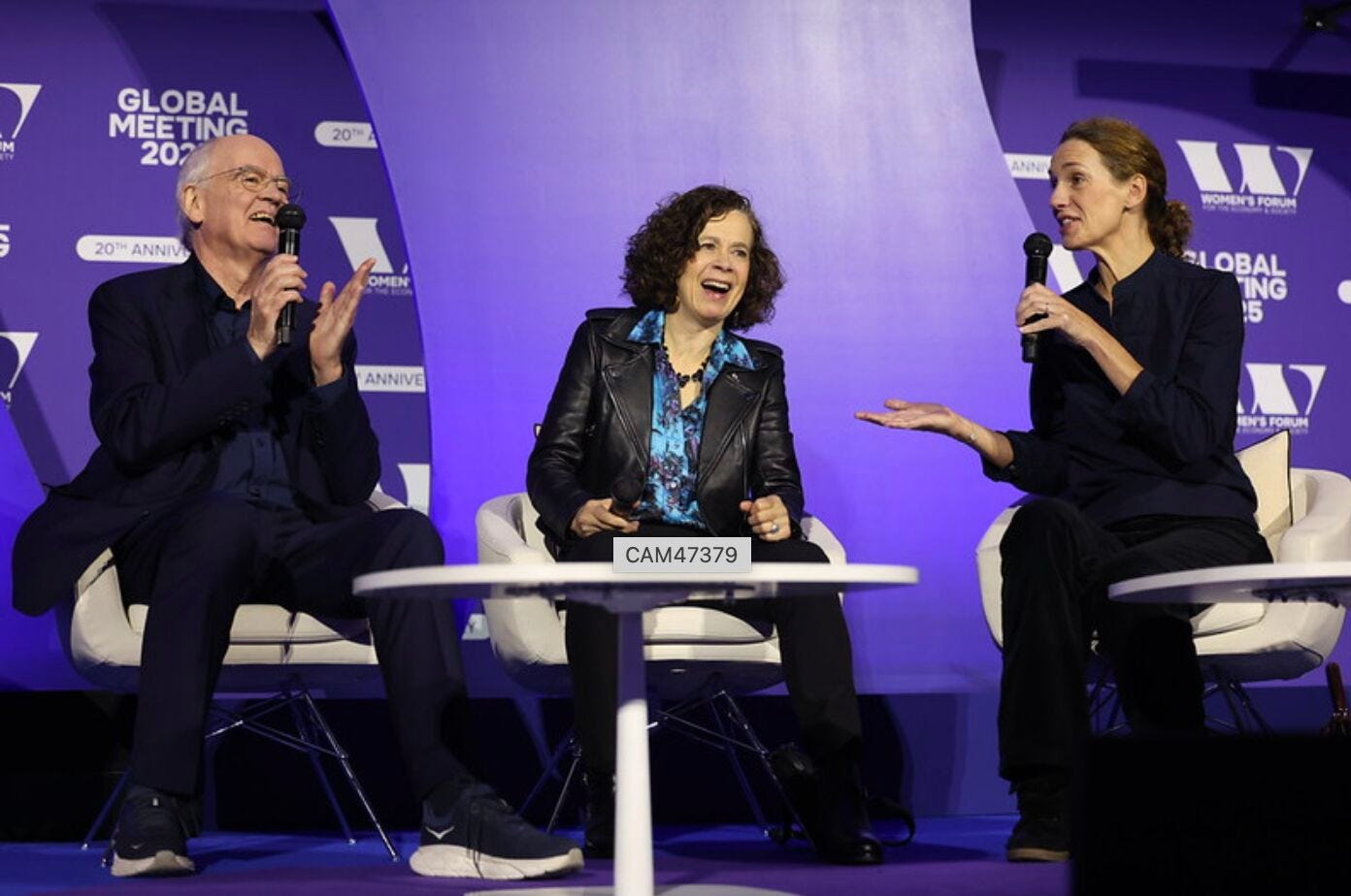 A group of people sitting on a stage

AI-generated content may be incorrect.