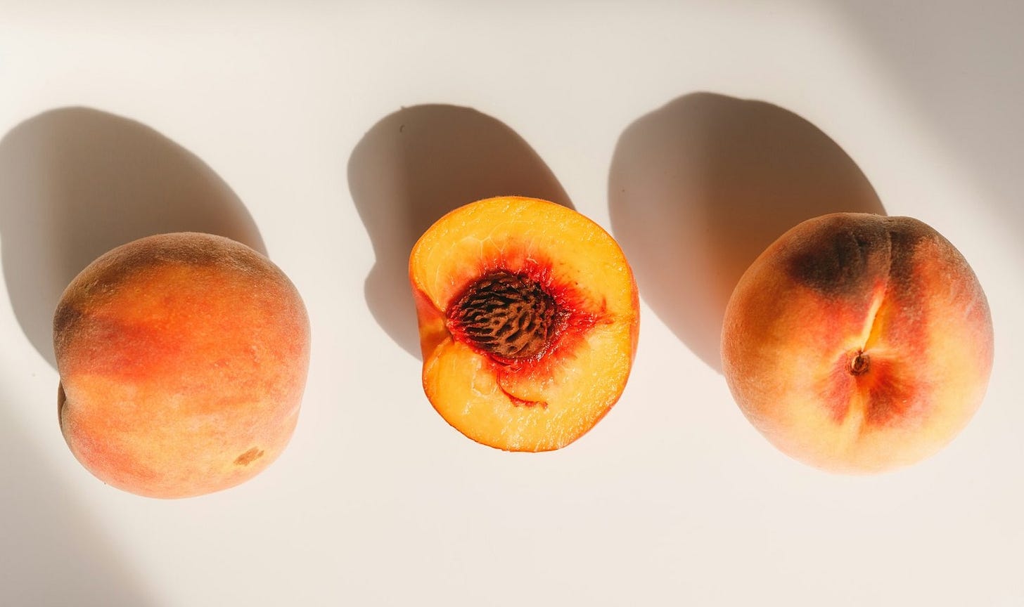 2 red and yellow peach fruits 2 red and yellow peach fruits