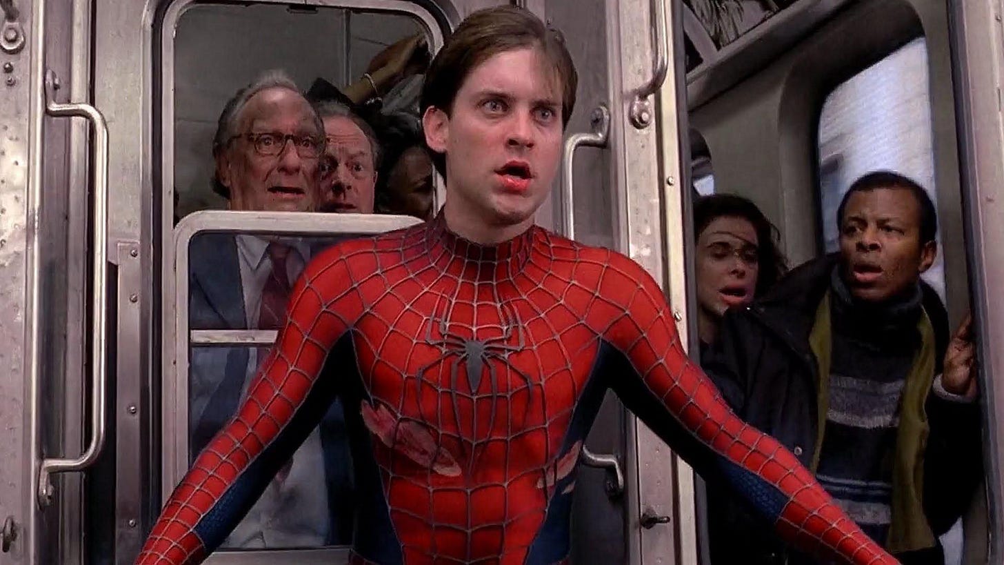 In SPIDER-MAN 2 Spider-Man takes off his mask and reveals he's Peter Parker  to a train full of passengers. This is a subtle nod to the theory that  Peter Parker is actually