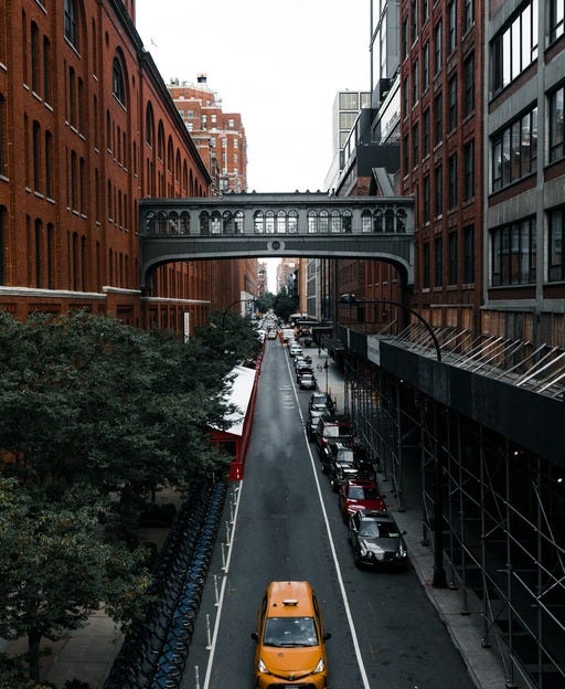 May be an image of fire escape, the Brooklyn Bridge, the Queensboro Bridge, street and road