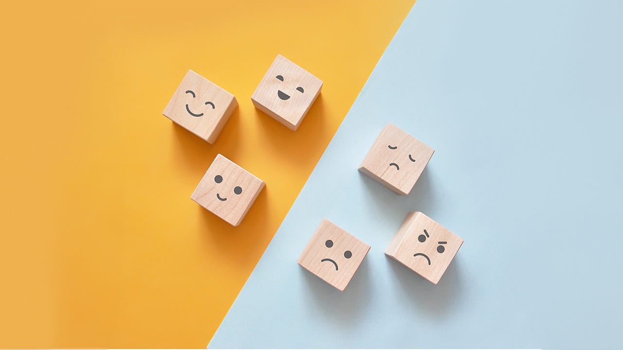 Image of different emotions on wooden cubes