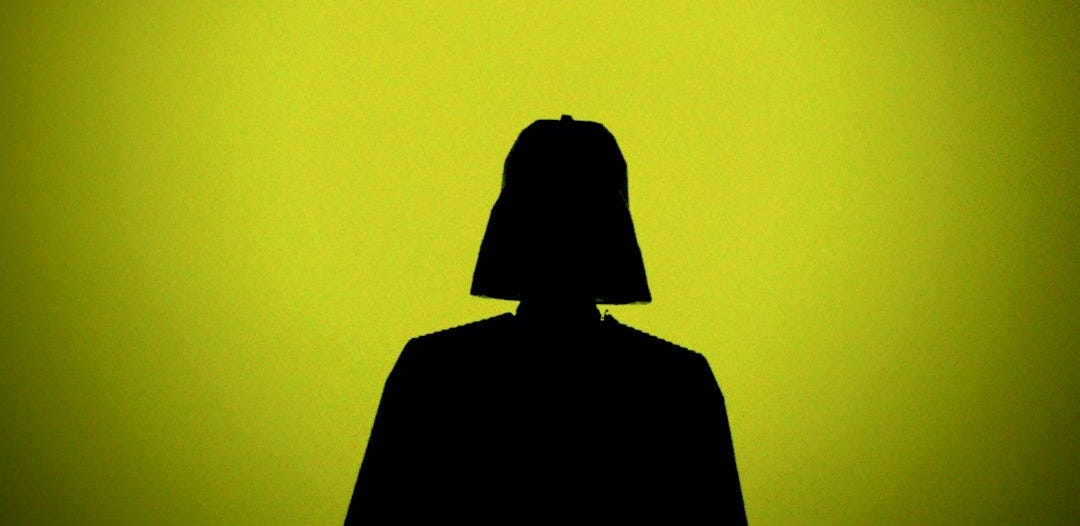 silhouette of person wearing black hoodie silhouette of person wearing black hoodie