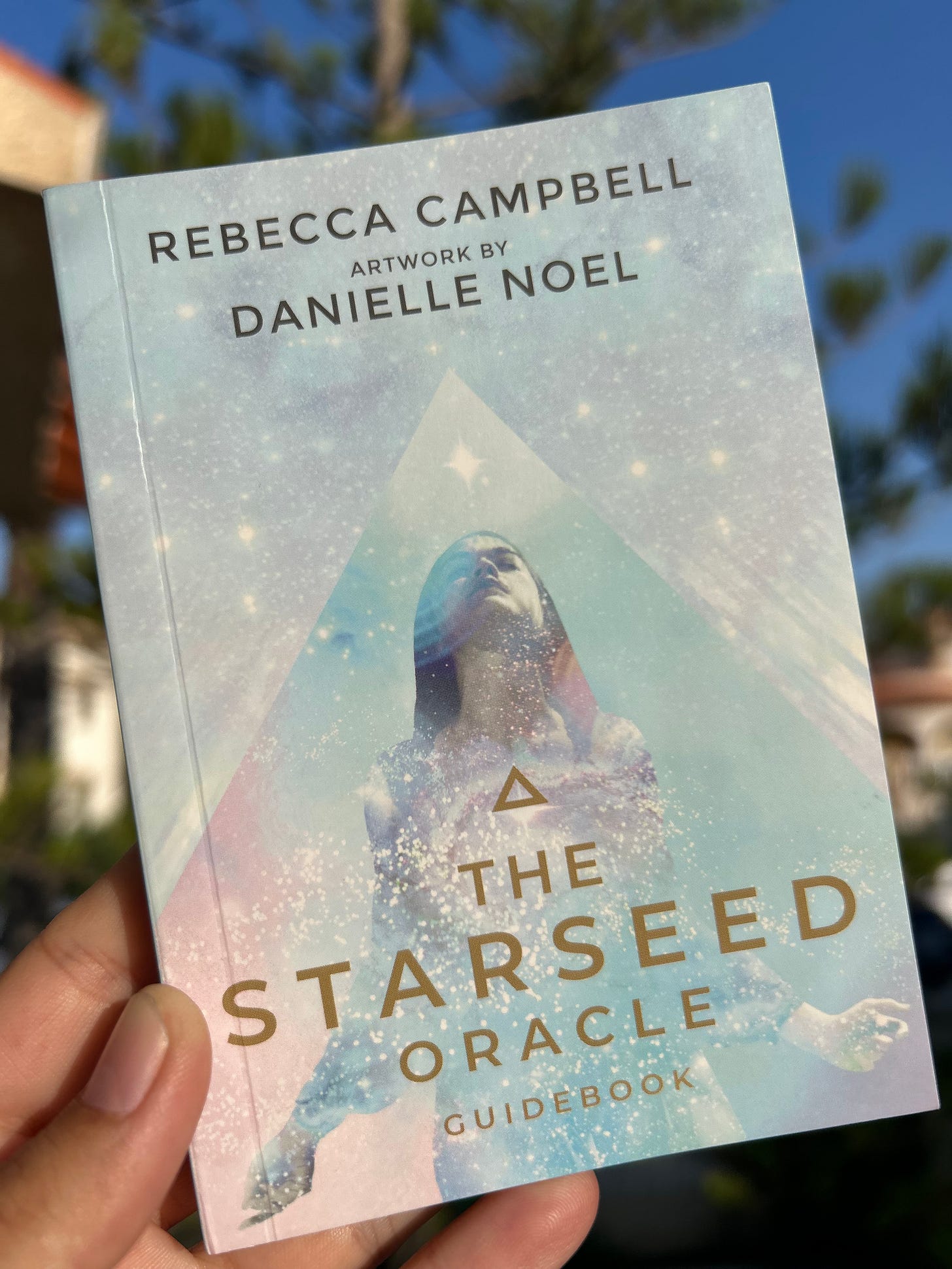 The Starseed Oracle guidebook by Rebecca Campbell
