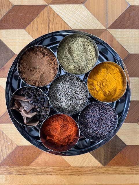 Four images of a stainless steel masala tin with seven spices suitable for Indian dishes and curries.