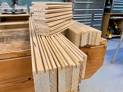 Dadoes and tenons being cut and wood pieces being dry-fit together