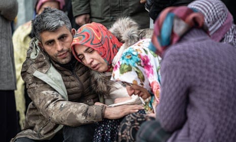 People mourn the death of their relatives in Turkey.