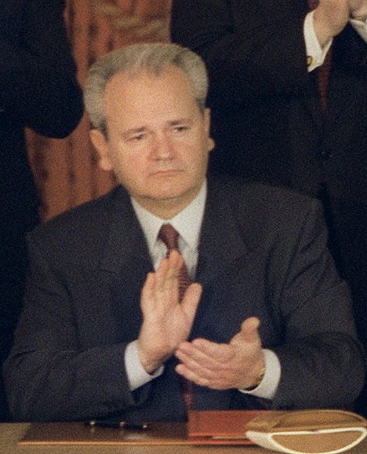 (Left) Slobodan Milosevic clapping.  (Right) Benjamin Netanyahu clapping.