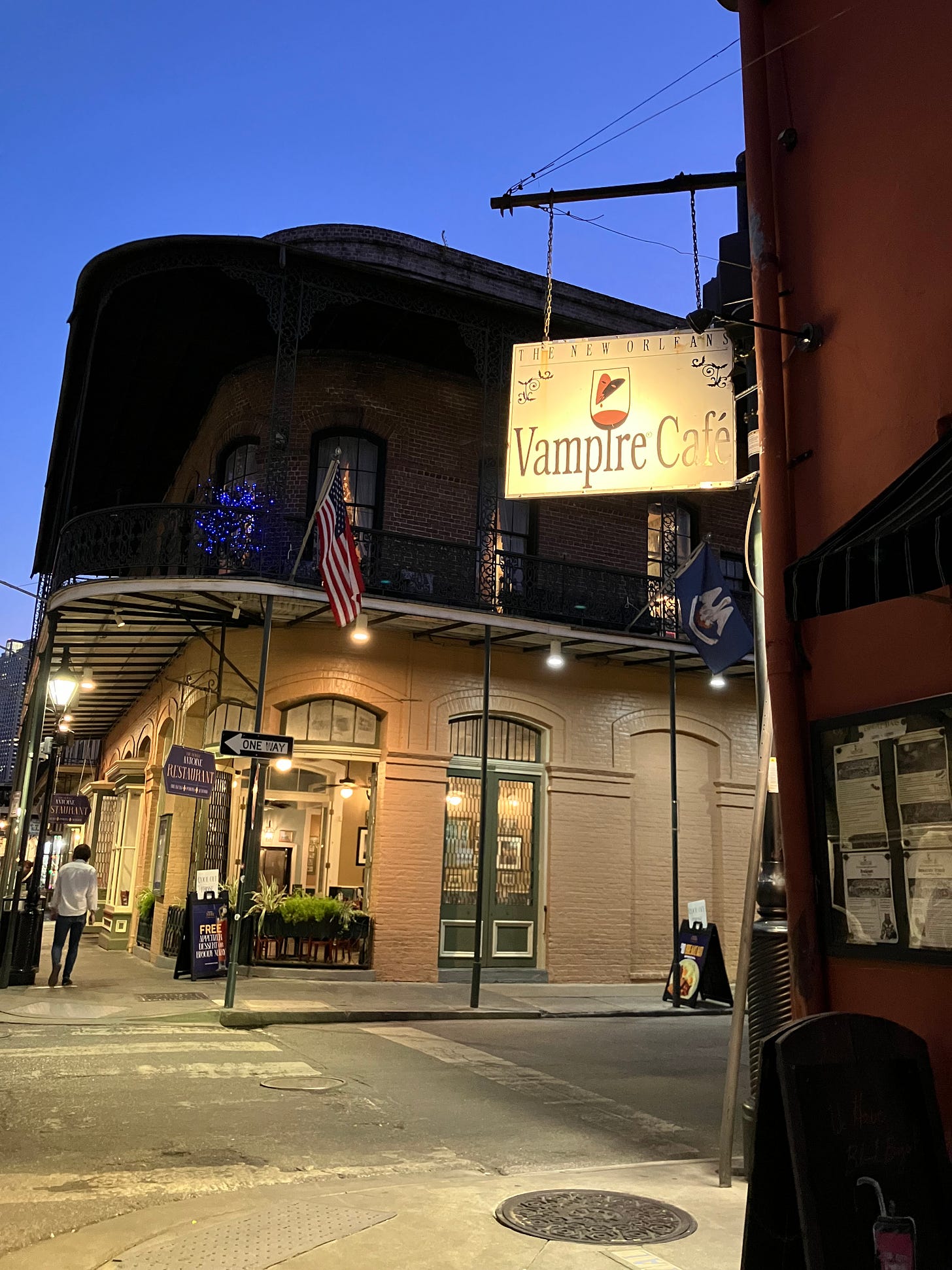 night time photo of Vampire Cafe on corner of New Orleans street