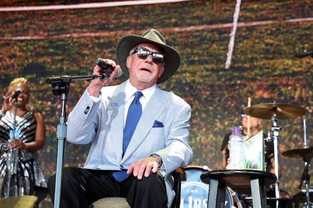Indianapolis Colts owner Jim Irsay performs in concert with the Jim Irsay Band during Farm Aid at Ruoff Home Mortgage Music Center on September 23,...