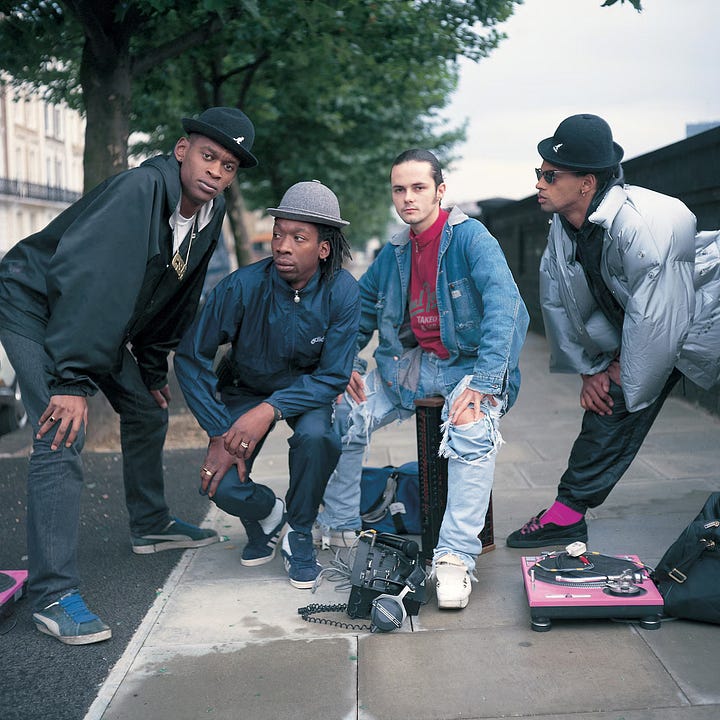 Left: Milo, Daddy G, Nellee Hooper, Willie Wee, and 3D at Dug Out, 1984. |. Right: Daddy G, Willie Wee, Nellee Hooper, and Milo Johnson in 1985. |. Beezer / PYMCA