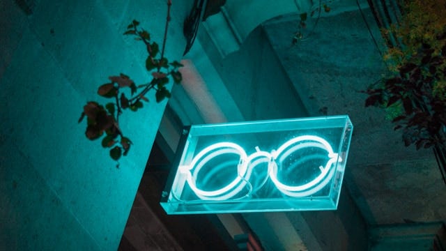Glasses hung in neon light