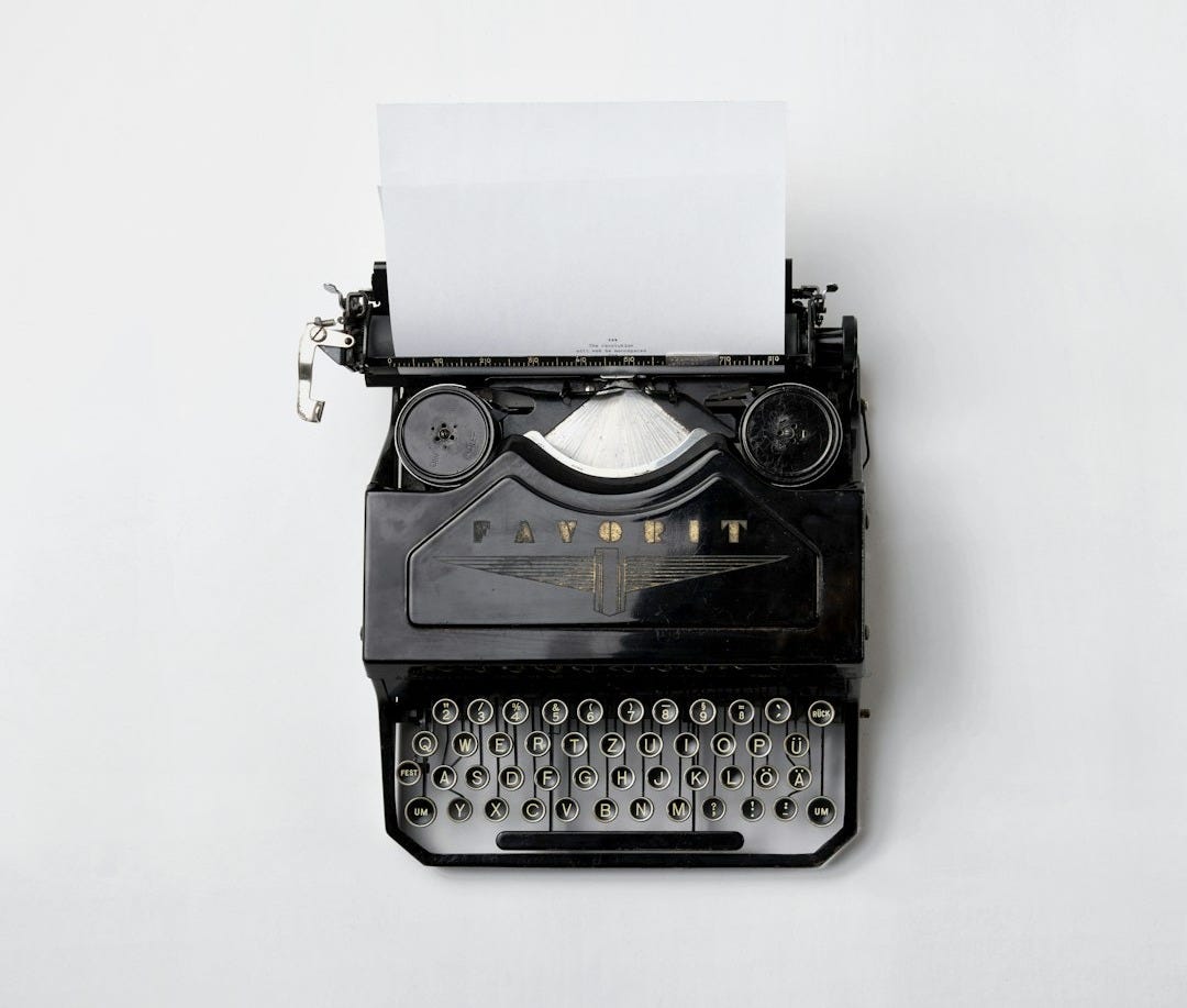 black Fayorit typewriter with printer paper black Fayorit typewriter with printer paper
