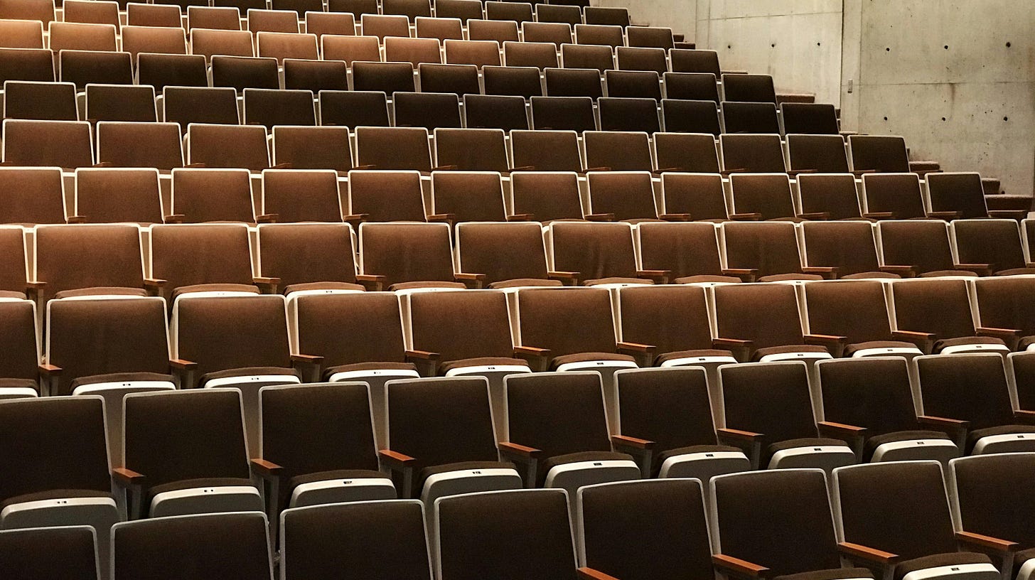 photography of theater chairs