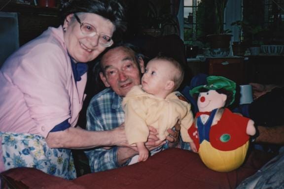 Edith and Peter dote on their first grandchild.