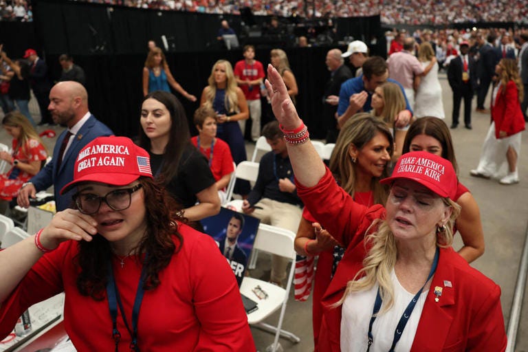 Some people wore red ‘MAGA’ caps with a twist: Make America Charlie Kirk.