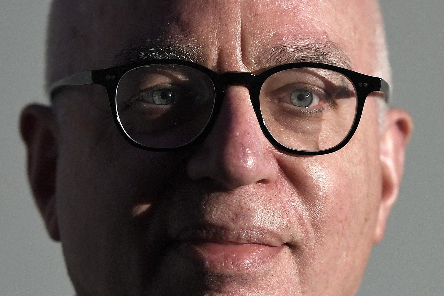 Close-up of Wolff's face with half in the shadow and half in the light. Close-up of Wolff's face with half in the shadow and half in the light.