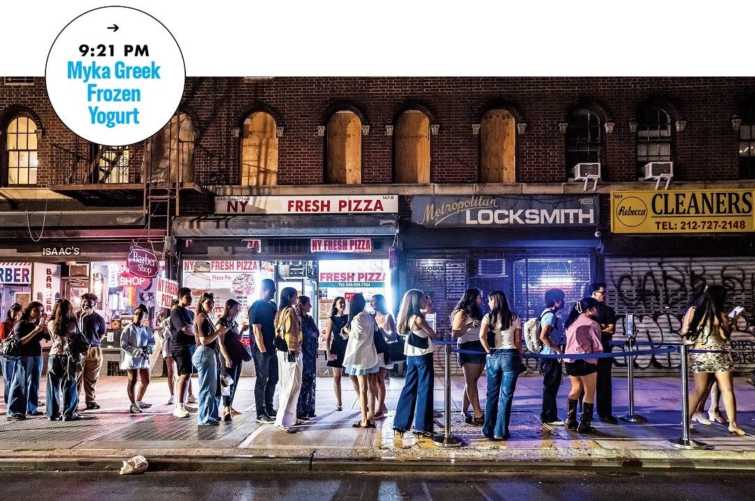 A long line of people at night on the streets of new york city A long line of people at night on the streets of new york city