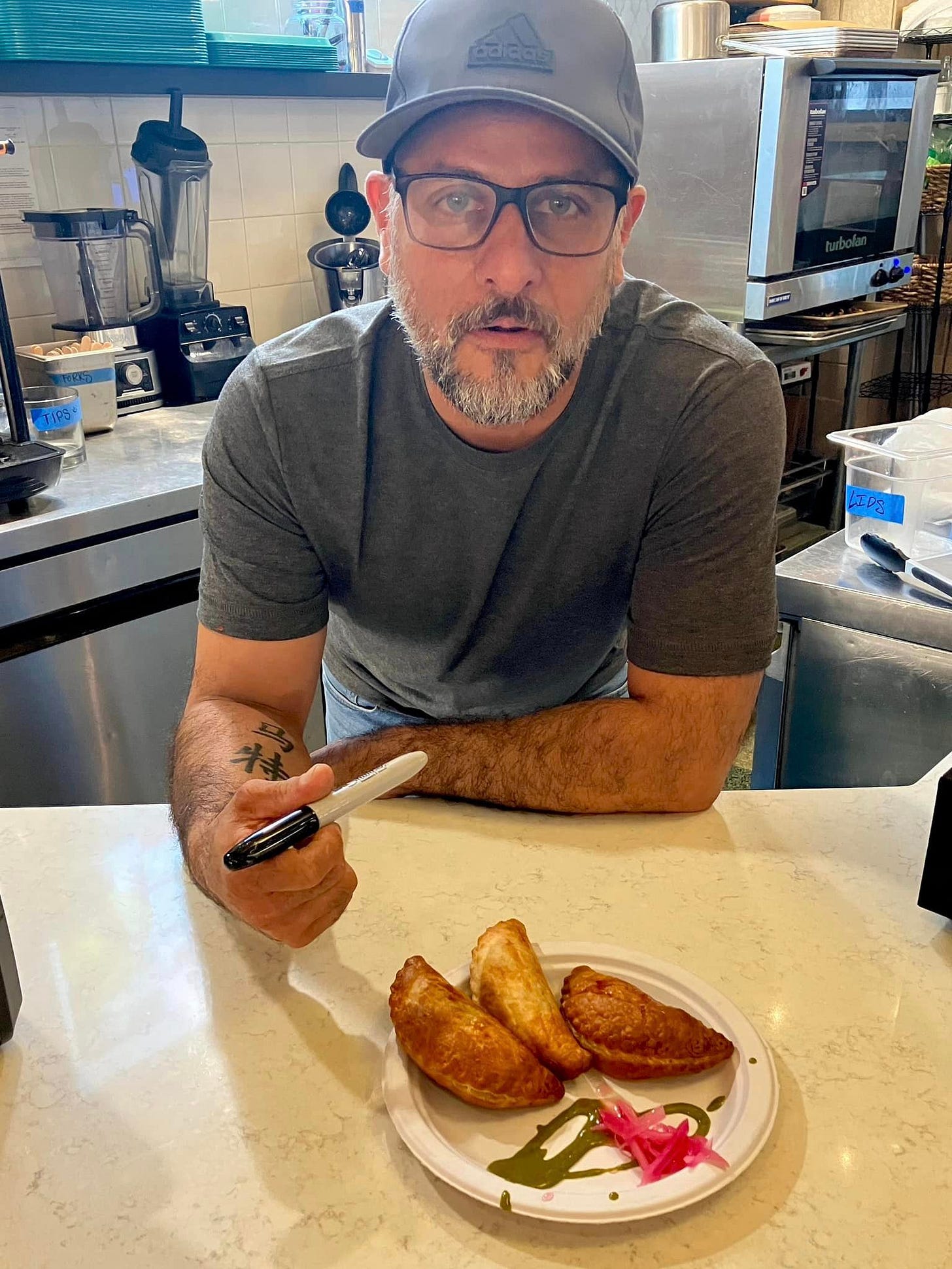 May be an image of 1 person and food