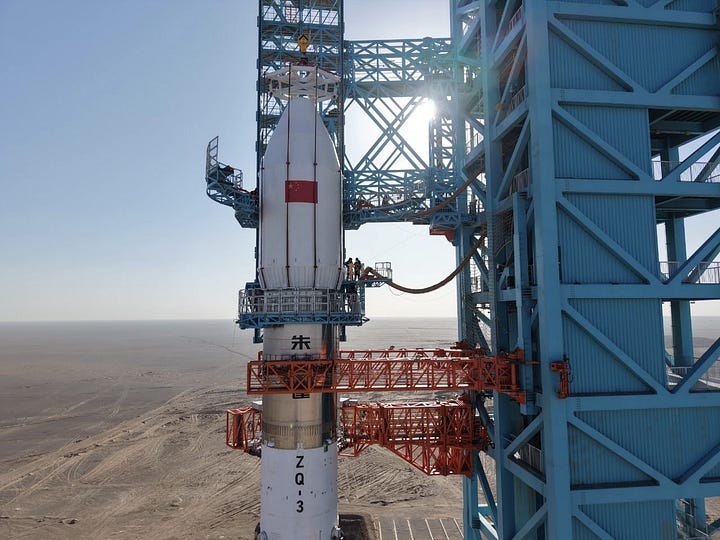LandSpace's Zhuque-3 Y1 vehicle heading to the launch pad and recieving its payload fairing.