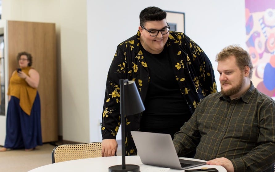 man using laptop on desk man using laptop on desk