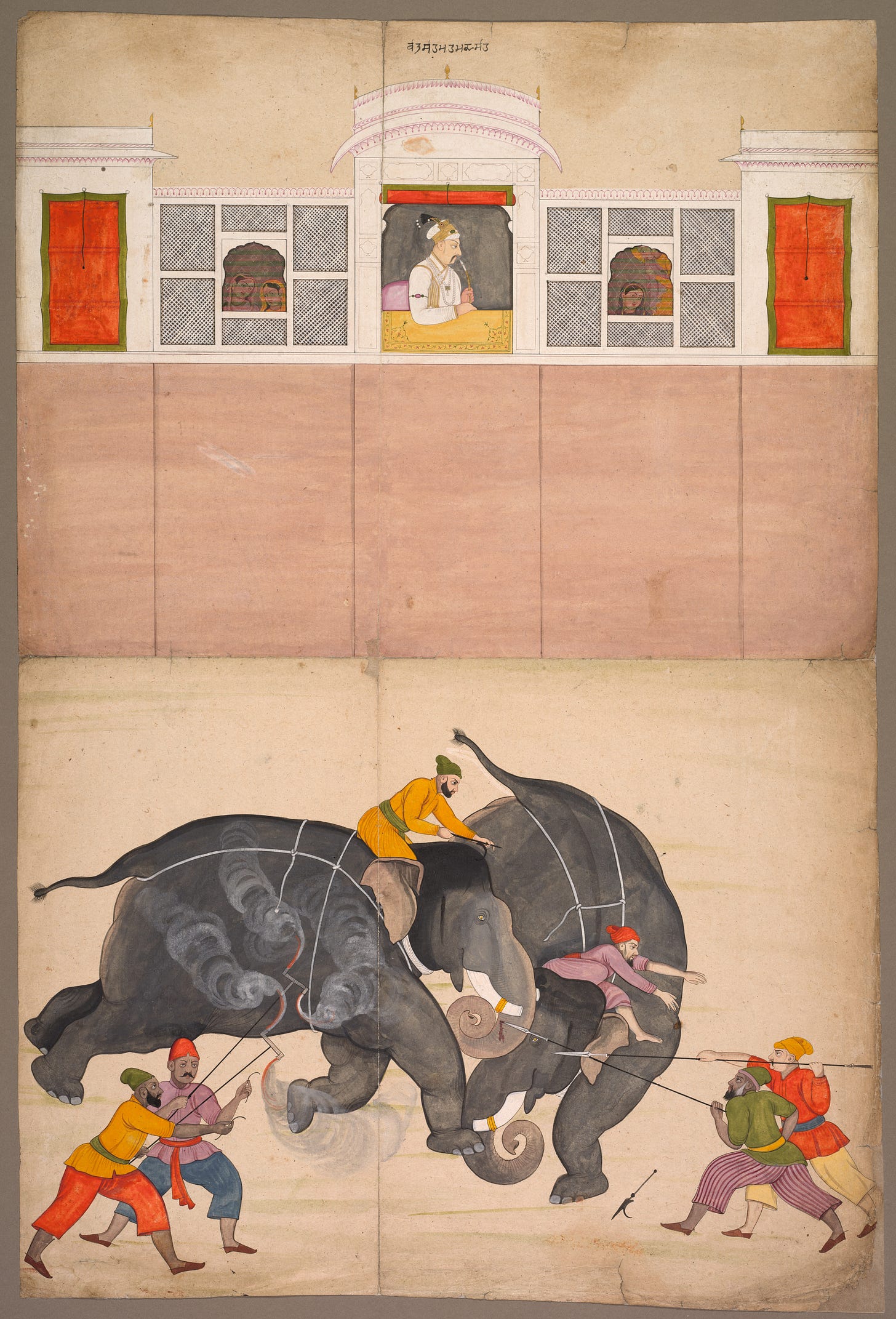  The Mughal emperor responsible for a revival of courtly arts and pastimes was Muhammad Shah (reigned 1719–48). This painting was made by an artist from a small kingdom in the western Himalayas who stayed at the Mughal court in Delhi and painted scenes of his experiences.  Like his predecessors, Muhammad Shah enjoyed watching elephant fights. He is shown in his window of public audience, marked by a golden carpet, smoking a hookah. Women from his harem can be seen looking on from behind painted screens.  Two pairs of men hold fire brands and spears to prevent the elephants from running off and to keep them under control. The intensity of the fight—captured at a moment when one mahout, or elephant trainer, has dropped his goad and is about to jump off—is augmented by the dense colors and forms in contrast to the otherwise pale planes, balanced only by the strip of palace windows. 