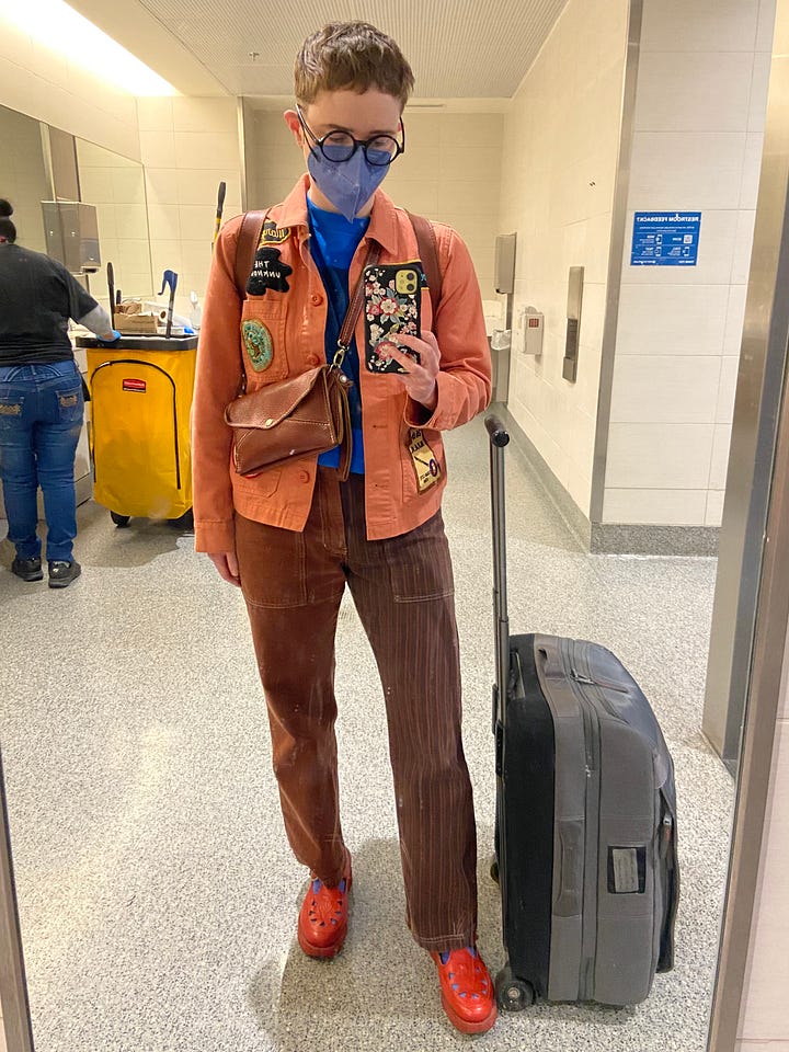 Two mirror selfies of me in an airport
