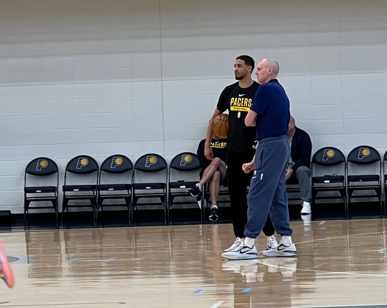 Tyrese Haliburton and Rick Carlisle talk after a practice.
