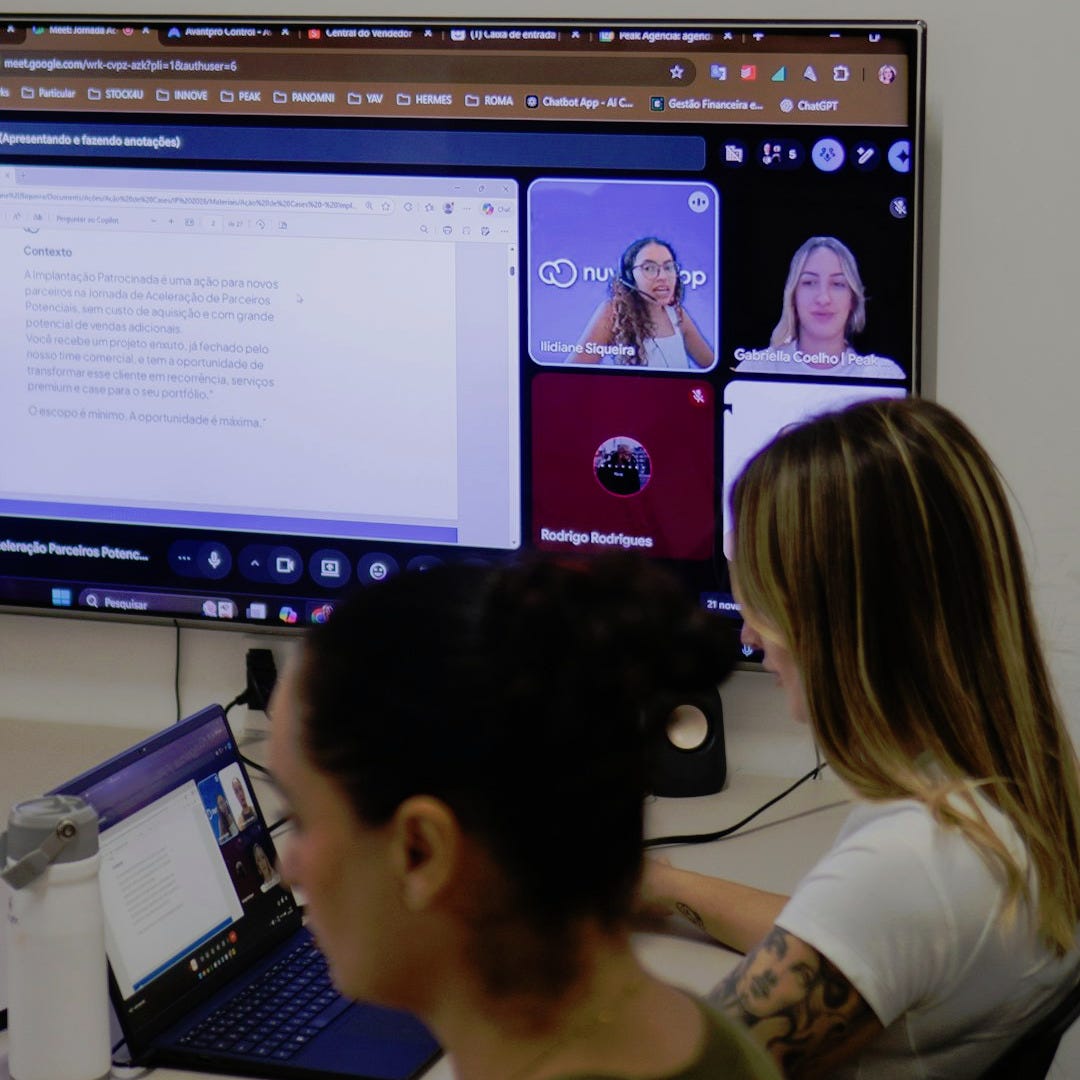 People in a video conference call on a large screen. People in a video conference call on a large screen.