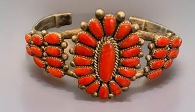 A bracelet with orange stones

AI-generated content may be incorrect.