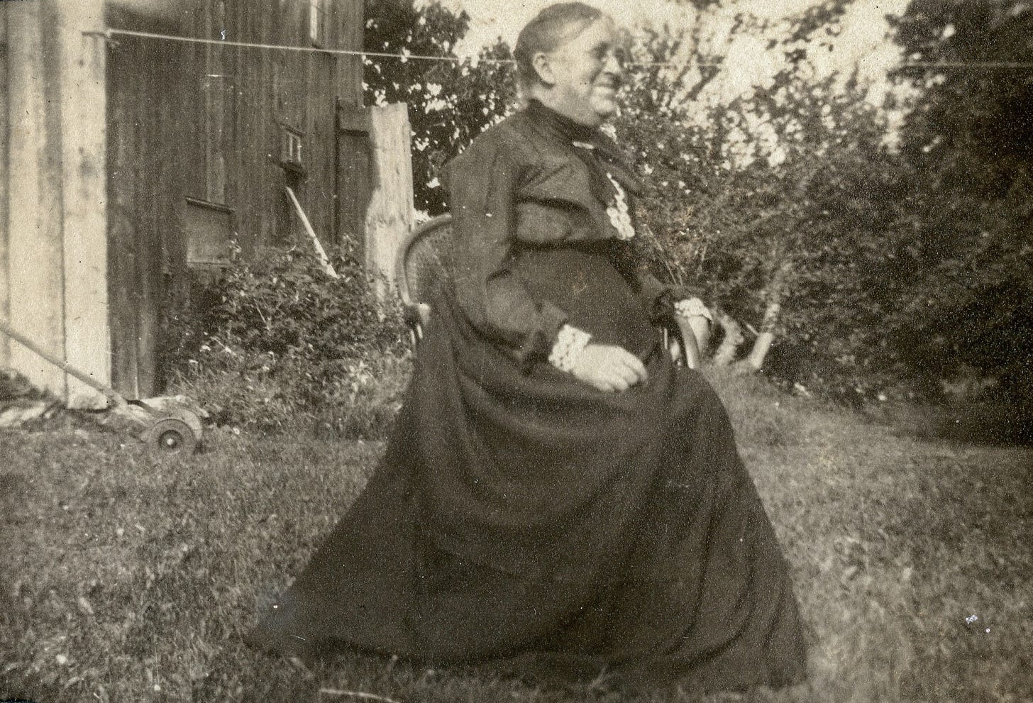 Woman sitting in wicker chair