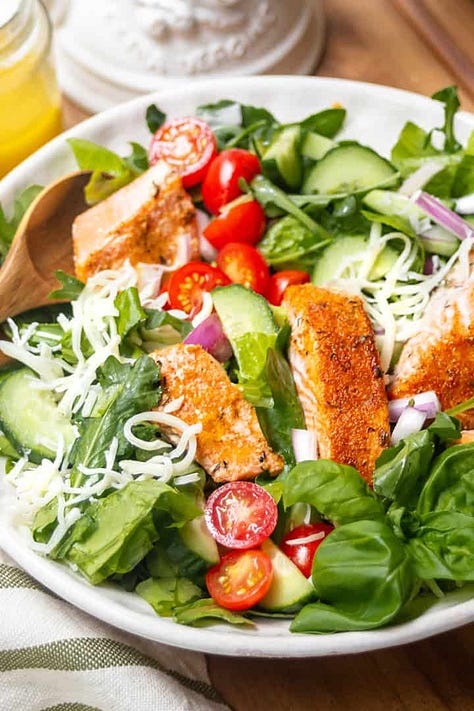 Six dinner salad recipes including Asian coleslaw, Caesar salad with chicken, salmon salad, Southwest chicken salad and a quick taco salad.