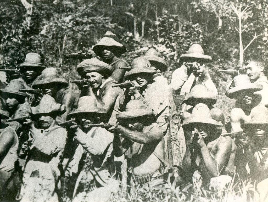 Cuban Liberation Army troops taking aim with Remington Rolling Block Rifles/Carbines during the War of 1895, circa 1895-1898.