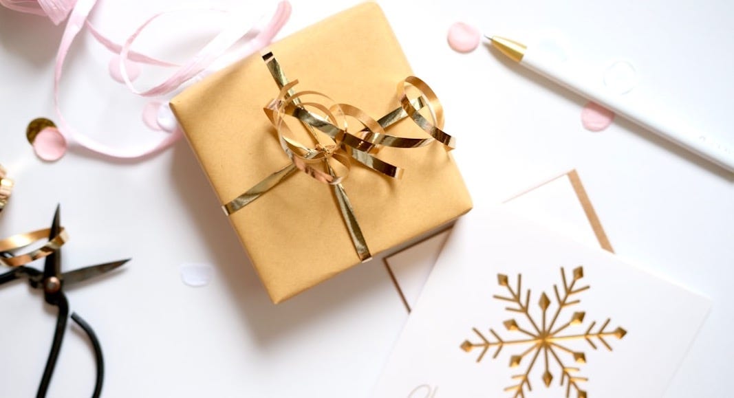 Gift wrapping supplies with present and snowflake card
