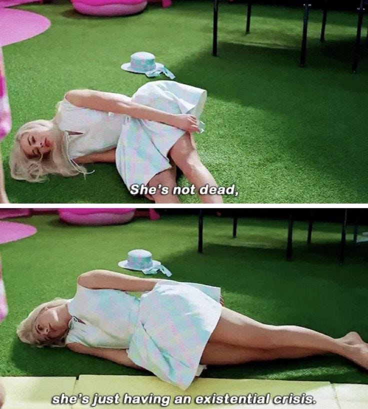 This may contain: a woman laying on top of a lush green field