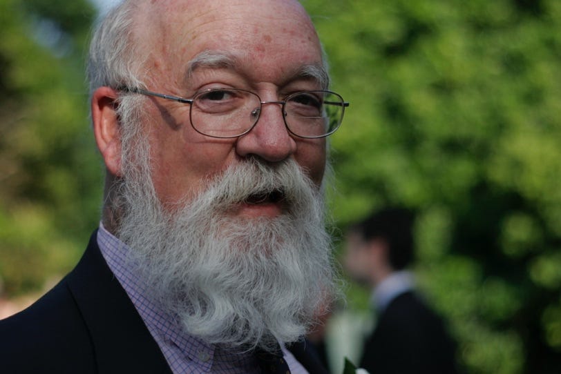 A person with a white beard

Description automatically generated