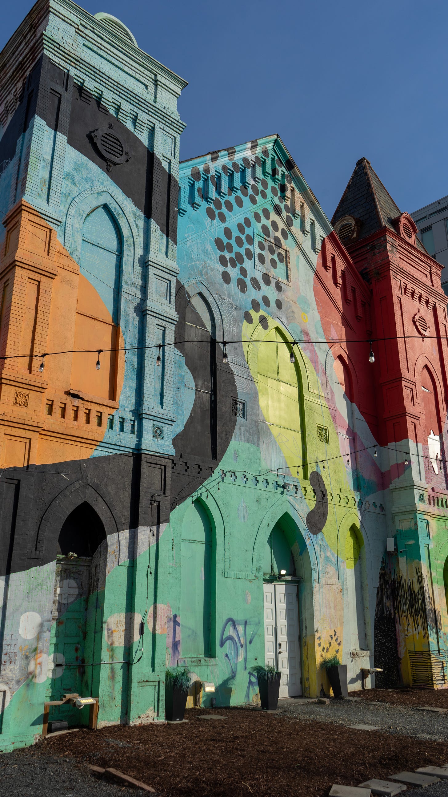 Image is an exterior shot of Culture House featuring vibrant and colorful swatch of paint created by HENSE Image is an exterior shot of Culture House featuring vibrant and colorful swatch of paint created by HENSE