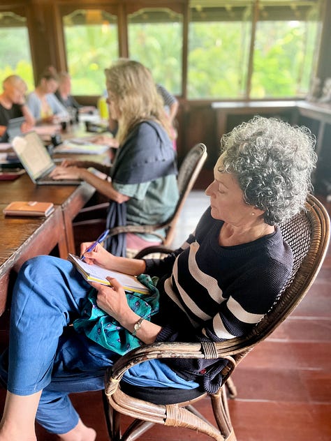 Women writing, participating in a Balinese blessing, standing by rice fields and swimming in a waterfall