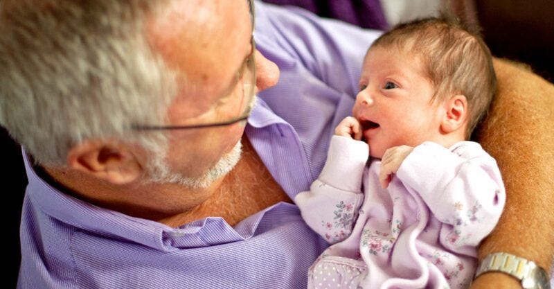 grandparent holding newborn