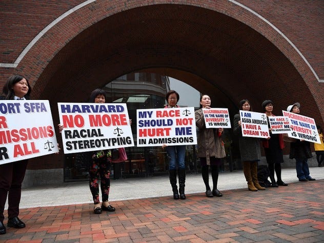 Photograph of demonstrators in front of the federal courthouse in Boston where the SFFA v. Harvard trial took place, with signs reading "Harvard No More Racial Stereotyping" and "My Race Should Not Hurt Me In Admissions. Photograph of demonstrators in front of the federal courthouse in Boston where the SFFA v. Harvard trial took place, with signs reading "Harvard No More Racial Stereotyping" and "My Race Should Not Hurt Me In Admissions.