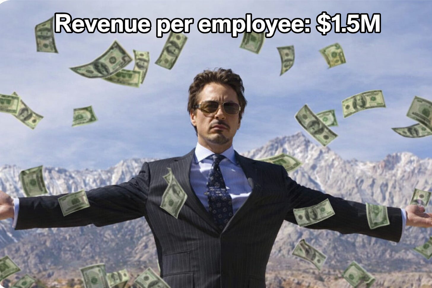Businessman in suit with arms outstretched as money falls around him, illustrating high revenue per employee ($1.5M) and extreme productivity in modern tech companies. Businessman in suit with arms outstretched as money falls around him, illustrating high revenue per employee ($1.5M) and extreme productivity in modern tech companies.
