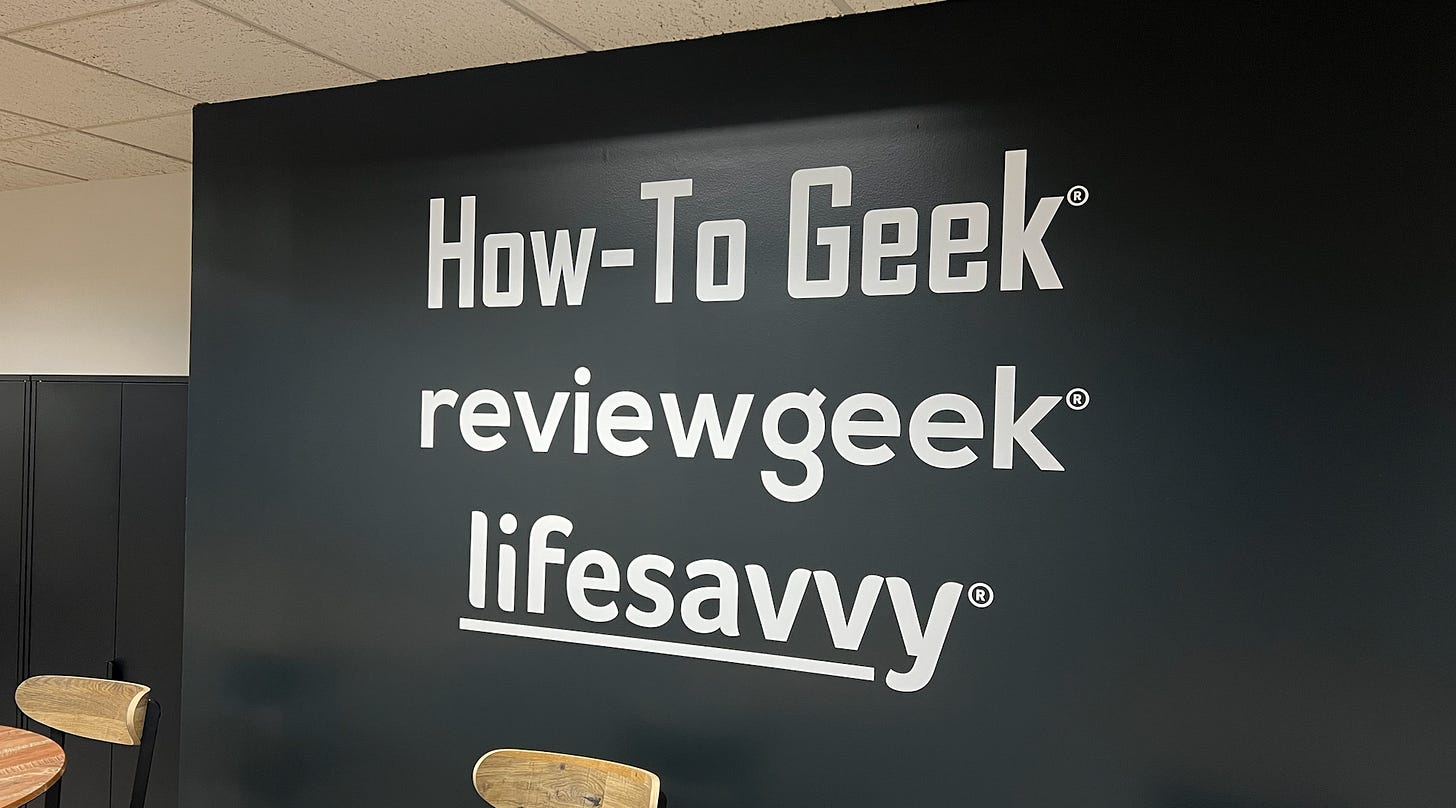 A How-To Geek sign in an office.