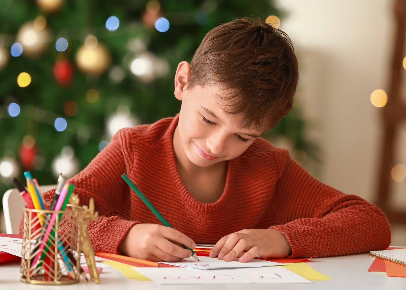 child writing during the holidays