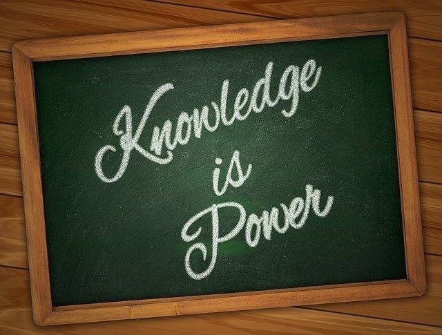 A chalkboard with writing on it

Description automatically generated