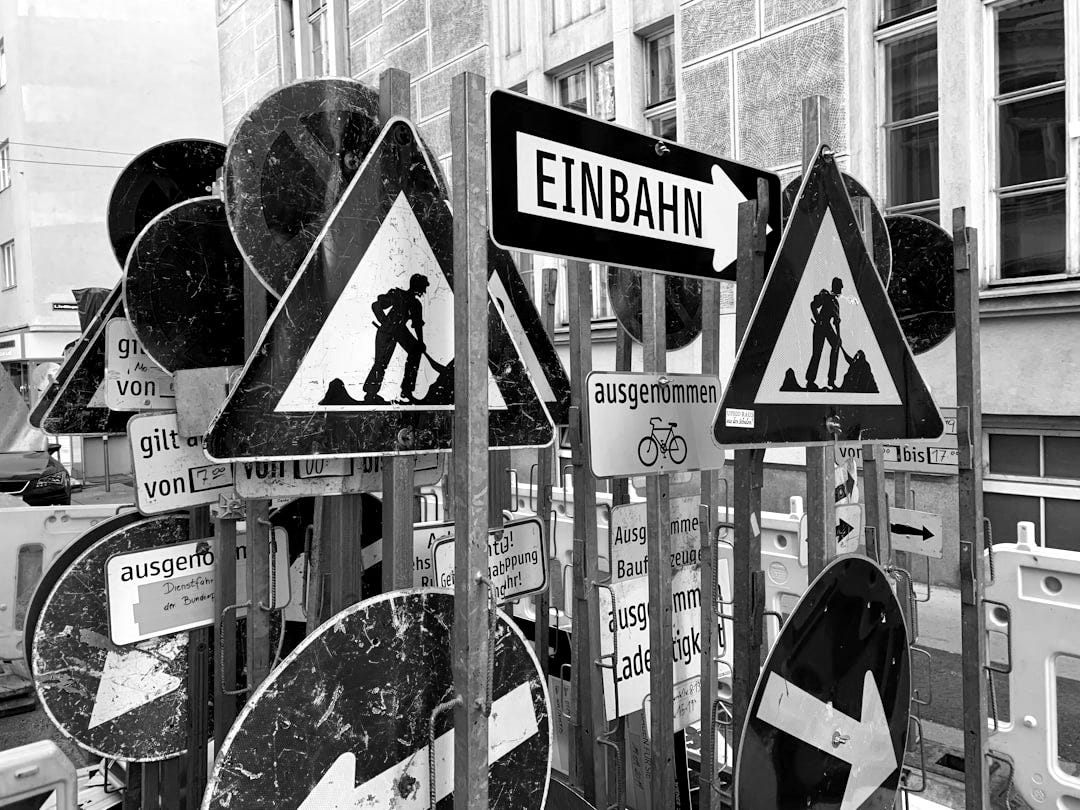 blue white and red arrow sign