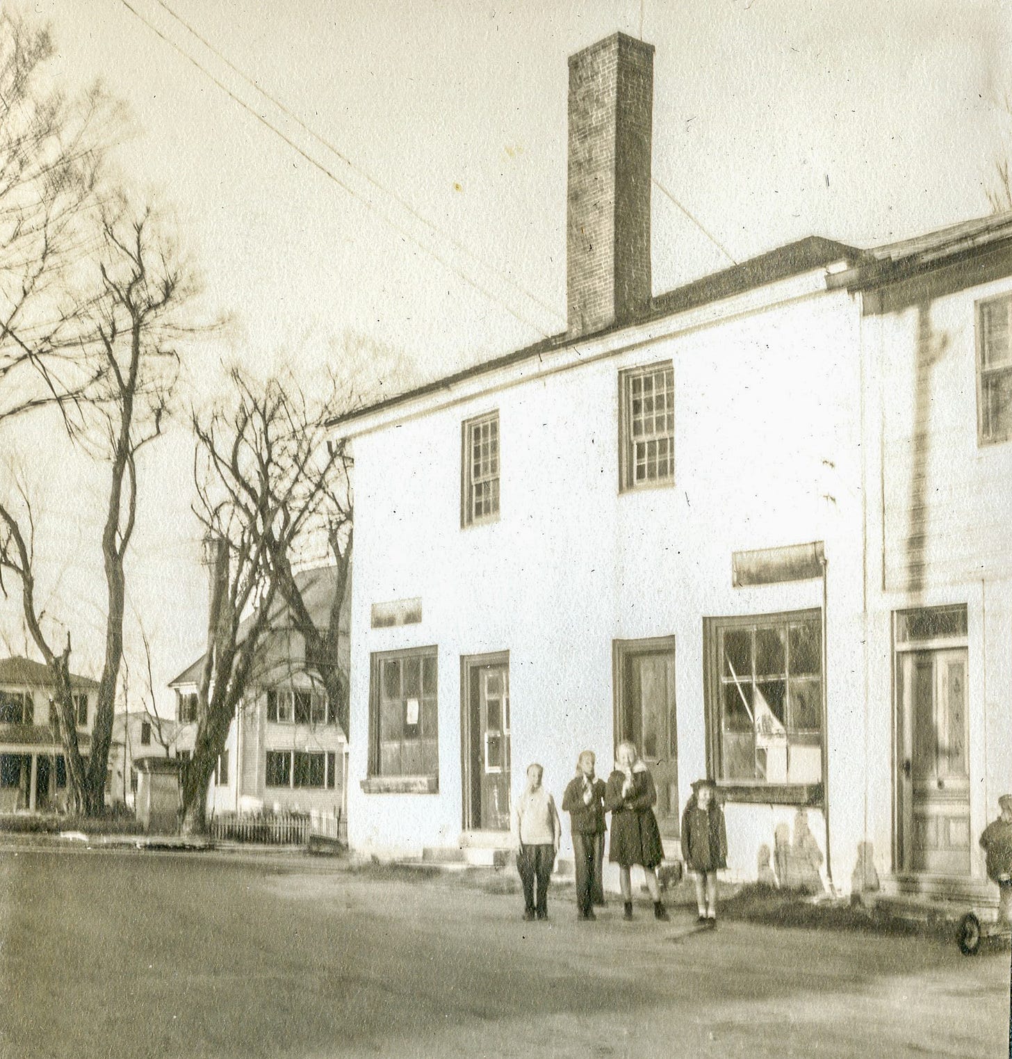 Corner store with 4 people