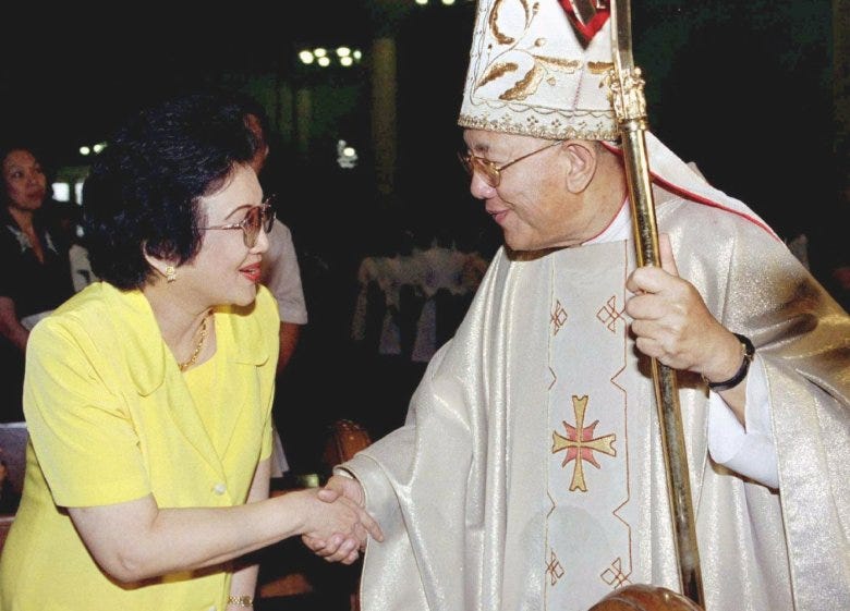 Manila Cardinal Jaime Sin greets former Philippine president Corazon Aquino at a special Mass June 10 coinciding with the launching of a new voters' watchdog group in the Philippines. 