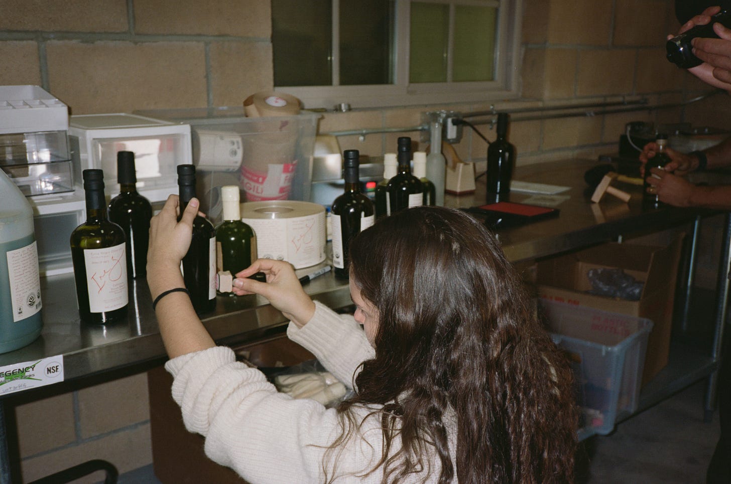Kelly labels bottles