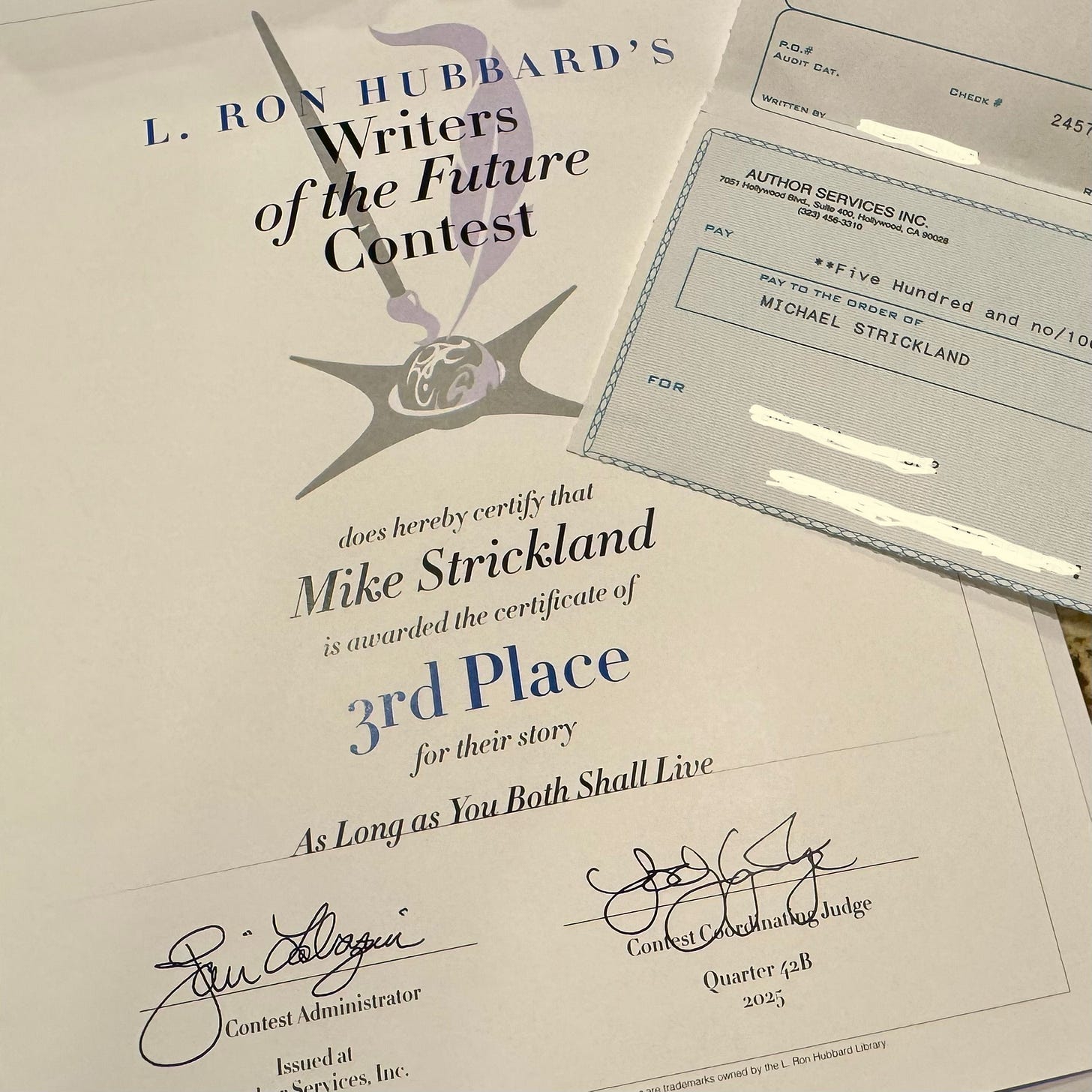 Winners certificate for L. Ron Hubbard's Writers of the Future Contest, with the name Mike Strickland awarded third place for their story As Long as You Both Shall Live, with a check for five hundred dollars